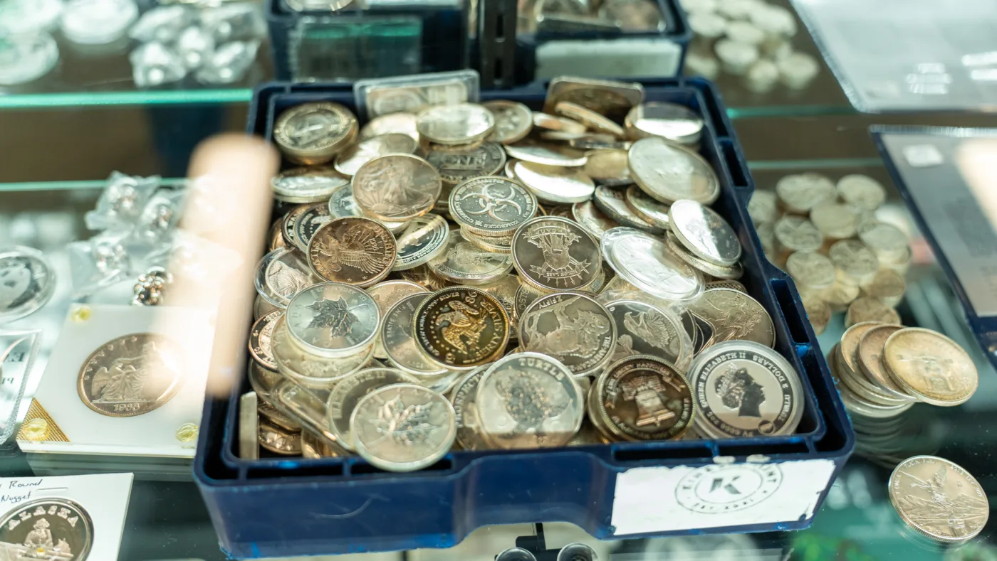A tray of mixed silver coins — the kind of collection David buys every week